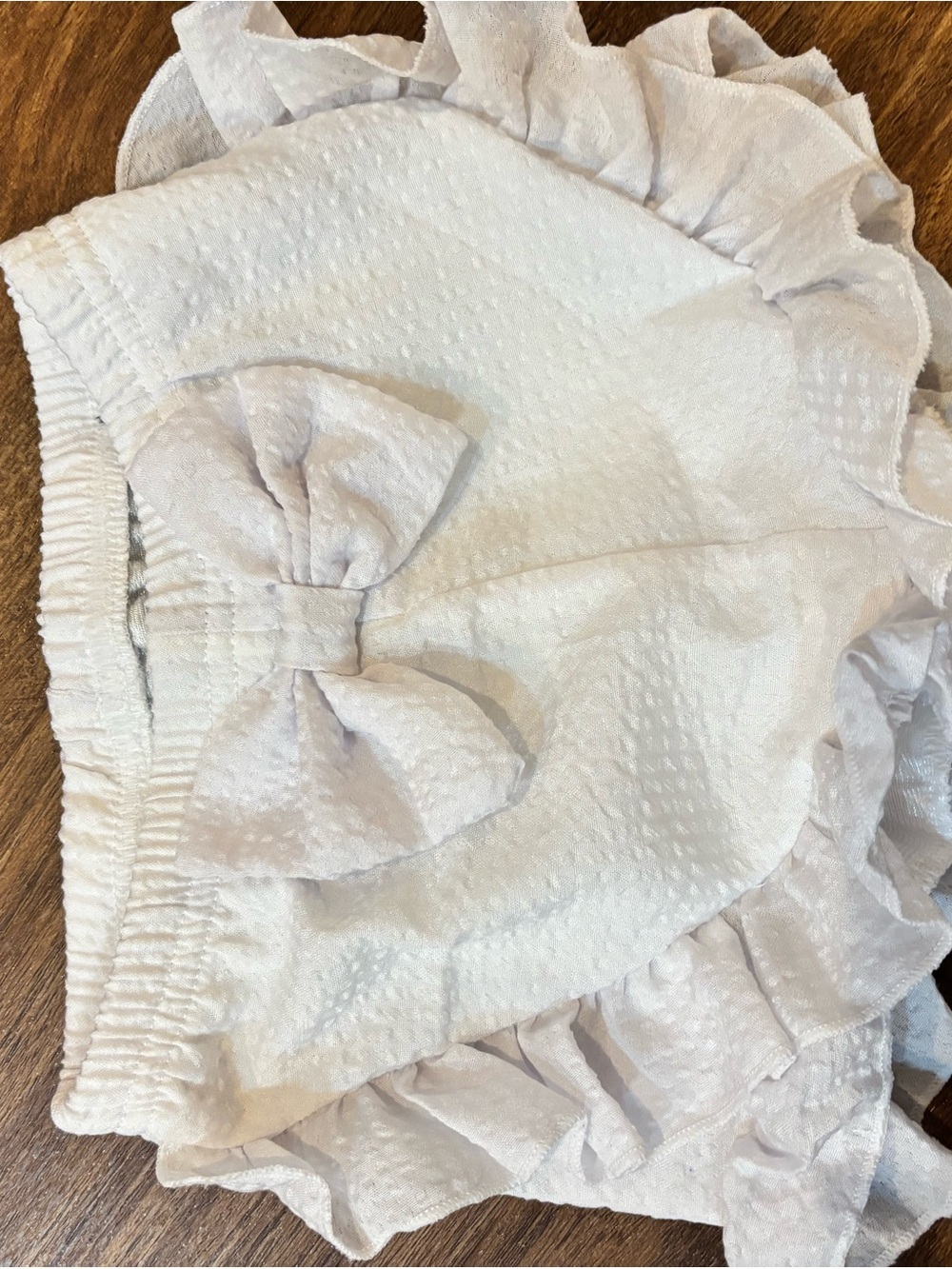 White Textured Seersucker Girls Ruffle Bow Shorts